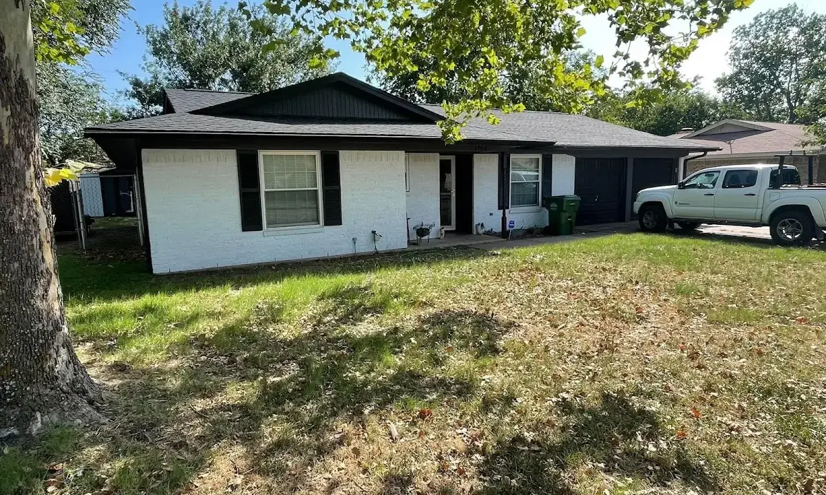 Professional roofing crew working on a residential roof in Mullica